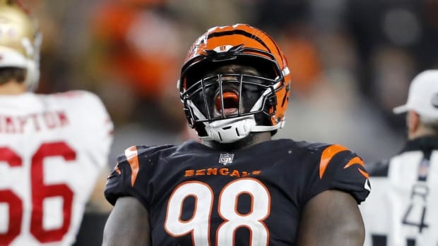 Dec 12, 2021; Cincinnati, Ohio, USA; Cincinnati Bengals nose tackle D.J. Reader (98) celebrates the sack during the fourth quarter against the San Francisco 49ers at Paul Brown Stadium. Mandatory Credit: Joseph Maiorana-USA TODAY Sports